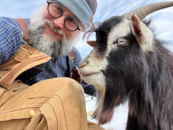 Goat (keith) and man looking at the camera